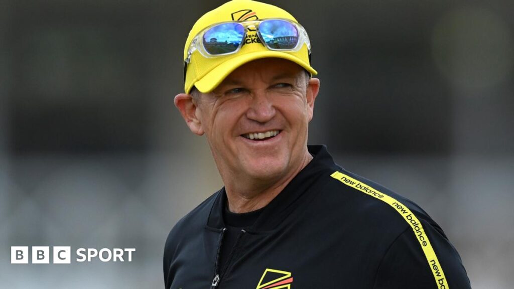 Andy Flower smiles, wearing a Trent Rockets cap