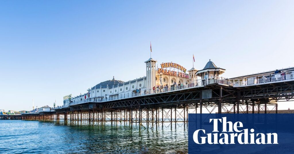Three men charged in connection with rape of woman on Brighton beach | UK news